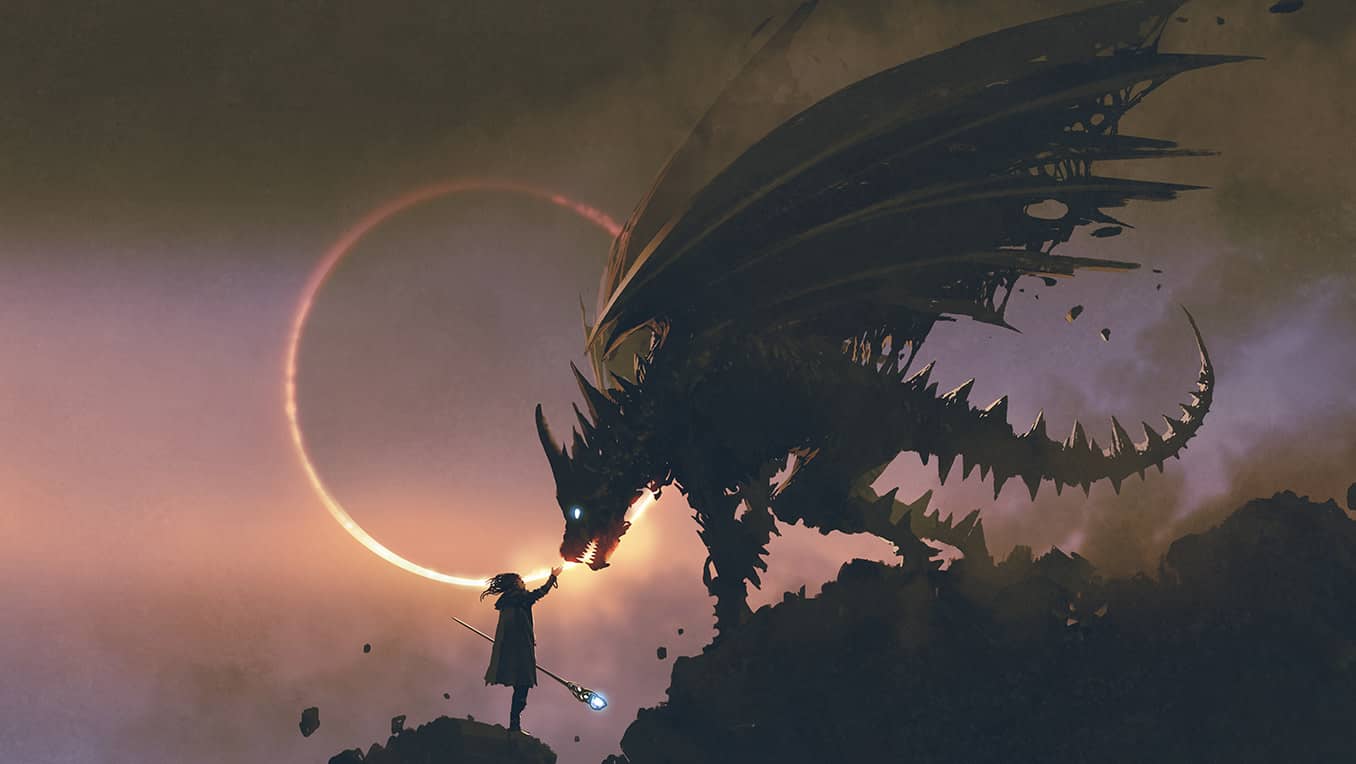 A wizard with a crystal staff on a craggy hill reaches out to a large dragon perched above