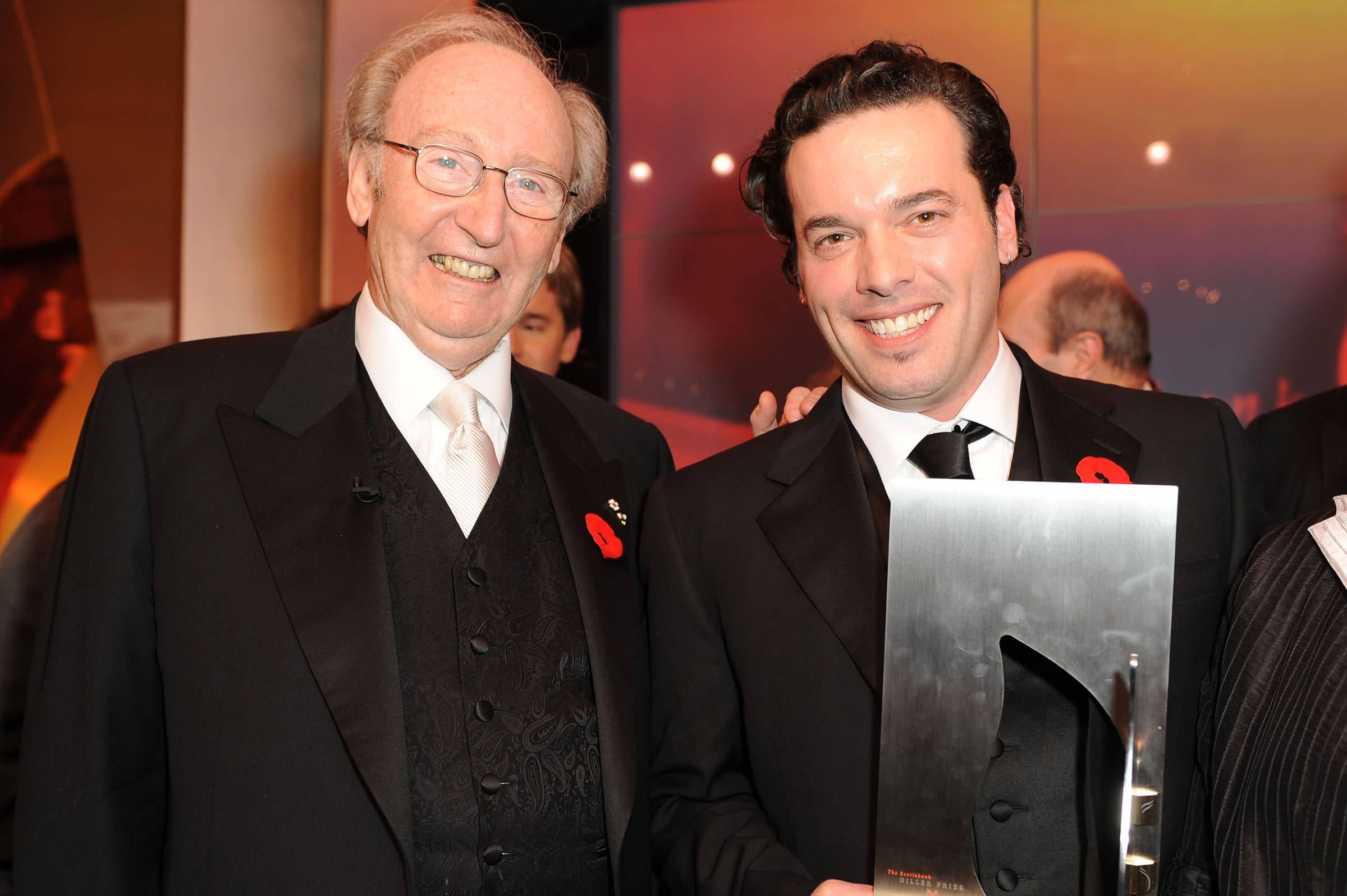 Picture of Joseph Boyden receiving the Giller Prize for his book Through Black Spruce